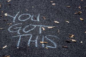 “You got this” written in chalk on blacktop.