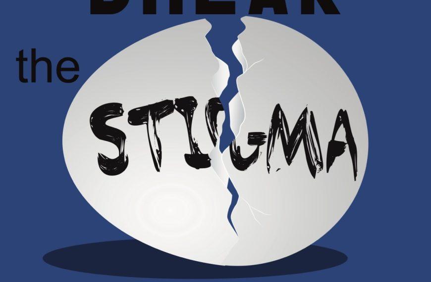 An egg cracked open with the word STIGMA written.
